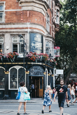 London, UK - July 24, 2018: People walking in front The Bloomsbury Tavern pub, one of the most historic pubs in Holborn, London, UK.のeditorial素材
