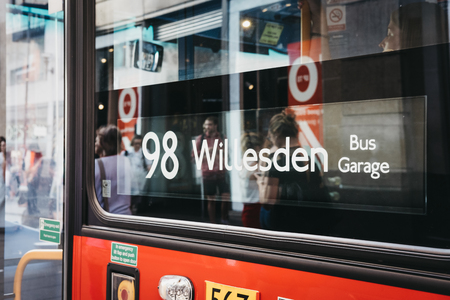 Close up of a red double decker bus number 98 sign towards Willesden on Oxford Street, London, UK. Double decker bus is an iconic symbol of the city.のeditorial素材