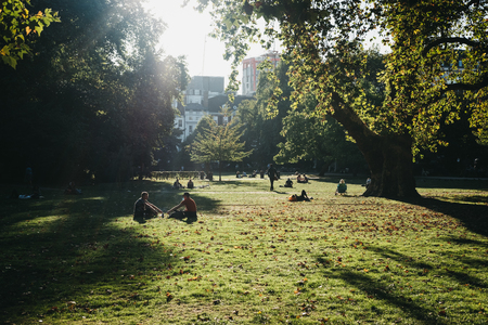 London, UK - September 17, 2018: People relaxing in Lincoln's Inn Fields on a sunny day in London, UK. Lincoln's Inn Fields is the largest public square in London.のeditorial素材
