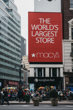 New York, USA - May 29, 2018: People walking on a street in from of Macy's in Manhattan, New York,...