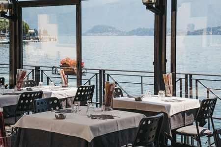Lenno, Italy - July 5, 2017: View of Lake Como from a seaside Plinio restaurant in Lenno. Lake Como is the third-largest in Italy after lakes Garda and Maggiore and is a popular tourist destination.のeditorial素材