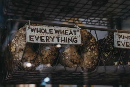 Whole wheat everything bagels on sale in New York, USA.の写真素材