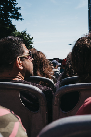 New York, USA - May 30, 2018: Tourists sitting on the top of tourist bus on tour around New York. New York is one of the most visited cities in the world.のeditorial素材