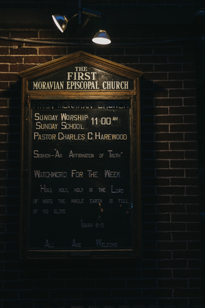 New York, USA - May 29, 2018: Information and quotes on an illuminated board outside the First Moravian Church on Lexington Avenue, New York. The Church has been at the present location since 1869.のeditorial素材