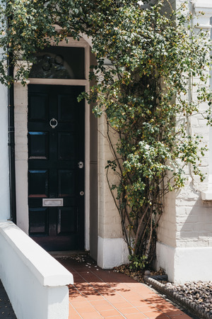 Close up of a wooden door of a traditional Victorian house in Barnes, an affluent residential area of London famous for its village atmosphere.のeditorial素材