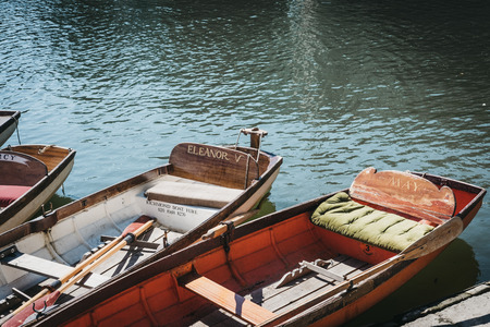 London, UK - August 1, 2018. Richmond Bridge Boat Hire wooden boats moored on the River Thames in...