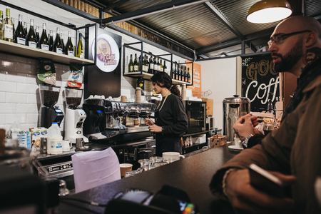 London, UK - November 2, 2018: People at Cafe Latino stand in Mercato Metropolitano, the first sustainable community market in London focused on revitalising the area and protecting environment.のeditorial素材