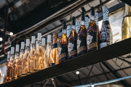 London, UK - November 2, 2018: Bottles at Cocktail Bar in Mercato Metropolitano, the first sustainable community market in London focused on revitalising the neighbourhood and protecting environment.のeditorial素材