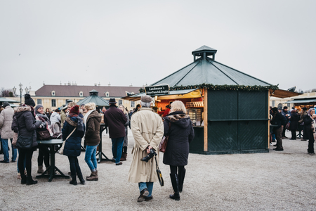 Vienna, Austria - November 25, 2018: People walking inside Christmas and New Year's Market at SchÃ¶nbrunn Palace, one of the most important architectural monuments in Austria.のeditorial素材
