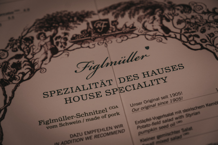Vienna, Austria - Novermber 24, 2018: Menu on the table at Figlmuller on Wollzeile restaurant in Vienna. Opened in 1905, it is often referred to as the âHome of the Schnitzelâ.のeditorial素材