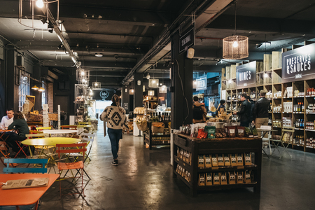 London, UK - January 13, 2019: People inside Mercato Metropolitano, the first sustainable community market in London focused on revitalising the area and protecting environment.のeditorial素材