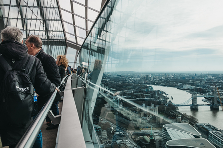 London, UK - January 13, 2019: People standing on an open air observation balcony in Sky Garden, London. Sky Garden, the highest public garden in London.のeditorial素材