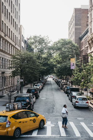 New York, USA - May 30, 2018: Yellow taxis on the street in New York, USA, in summer. Yellow taxis...