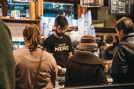 London, UK - January 26, 2019: People paying at the till inside Cafe Nero, a British European style coffee house brand headquartered in London, England, UK.のeditorial素材