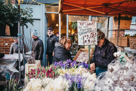 London, UK - February 03, 2019: Market sellers at the Columbia Road Flower Market, a street market in East London that is open every Sunday.のeditorial素材