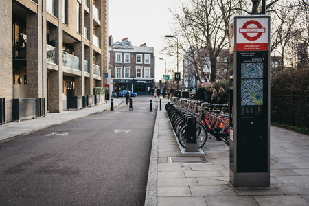 London, UK - February 03, 2019: Santander cycles docking station in Haggerston, London. Santander cycles are part of transport for London and are a popular option for commute in the city.のeditorial素材