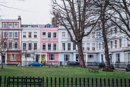 London, UK - February 16, 2019: Chalcot Square Gardens and colourful terraced houses of Primrose Hill on the background. Primrose Hill is one of the most expensive residential areas in London.のeditorial素材