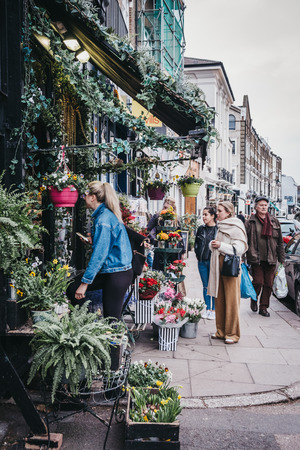 London, UK - February 16, 2019: People by the The Fitzroy's Flowers Collection florist in Primrose Hill, an upscale area of North London that got its name from the famous Primrose Hill.のeditorial素材