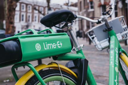 London, UK - February 16, 2019: Dockless Lime E electric bike on a street in Primrose Hill, London. Bike sharing company Lime, by Californian transportation company, arrived to London in December 2018のeditorial素材