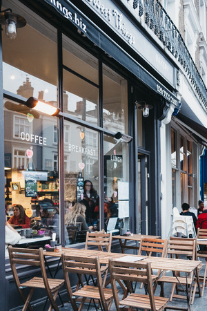 London, UK - February 16, 2019: People inside Sweet Things cafe in Primrose Hill, an upscale area of North London that got its name from the famous Primrose Hill.のeditorial素材