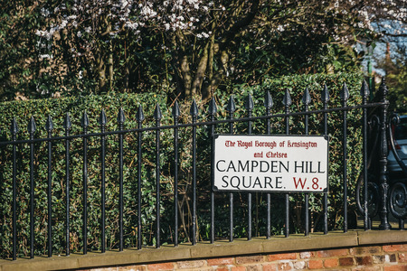 London, UK - February 23, 2019: Campden Hill Square street name sign on a black fence in The Royal...