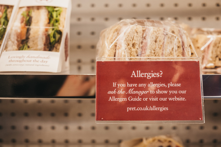 London, UK - February 23, 2019: Allergies notice next to sandwiches inside Pret a Manger, a popular international sandwich shop chain based in UK with approximately 500 shops in nine countries.のeditorial素材