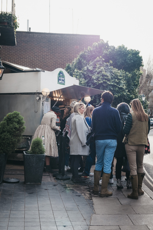 London, UK - March 2, 2019: People queuing for La Creperie de Hampstead in Hampstead, an affluent area favoured by academics, artists and media figures.のeditorial素材