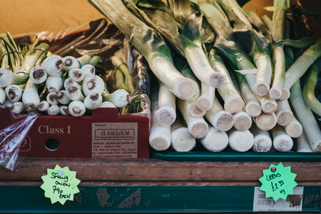 London, UK - February 03, 2019: Leeks and spring onions on sale at a convenience store in London, UK. These stores are located throughout the city and are a great way to buy fresh produce.のeditorial素材
