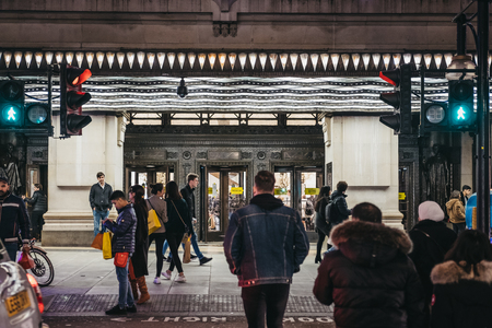 London, UK - March 9, 2019: People crossing Oxford Street, London, in front of Selfridges, second largest shop in the UK that opened on 15 March 1909.のeditorial素材