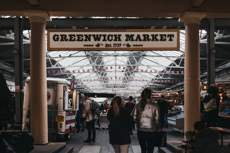 London, UK - March 16. 2019: People entering Greenwich Market, London's only market set within a World Heritage Site. Selective focus on the foreground.のeditorial素材