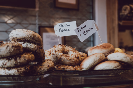 Close up of a variety of bagels on sale, selective focus.の写真素材