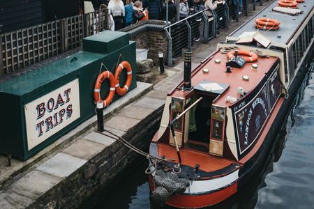 London, UK - March 23, 2019: Tour boat moored on Regent's Canal inside Camden Market, London. In 2020 the Regentâs Canal will be 200 years old.のeditorial素材