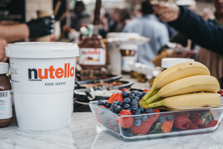 London, UK - March 23,2019: Nutella and fruits at Dutch pancakes stall inside Camden Market, London. Started with 16 stalls in 1974, Camden Market is one of the busiest retail destinations in London.のeditorial素材