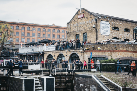 London, UK - March 23, 2019: People walking inside Camden Market, London. Started with 16 stalls in March 1974, Camden Market is one of the busiest retail destinations in London.のeditorial素材