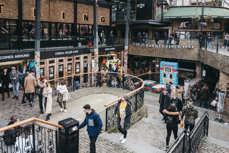 London, UK - March 23,2019: People walking inside Camden Stables Market, London. Started with 16 stalls in March 1974, Camden Market is one of the busiest retail destinations in London.のeditorial素材