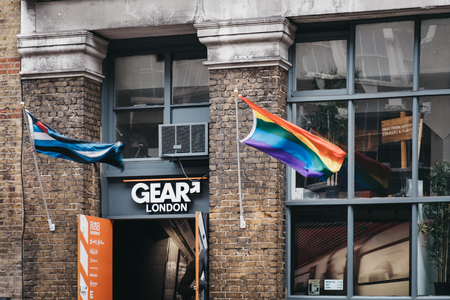 London, UK - April 6, 2019: Rainbow flag, a symbol of lesbian, gay, bisexual and transgender (LGBT) pride and social movements, on a building in London, UK. The flag is also a symbol of peace.のeditorial素材