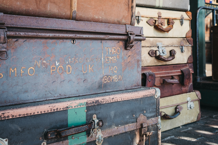 Sheringham, UK - April 21, 2019: Retro decorative suitcases on the platform of Sheringham train station on a sunny spring day. Sheringham is an English seaside town within the county of Norfolk, UK.のeditorial素材