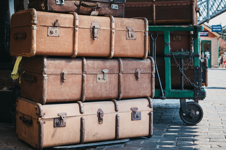 Sheringham, UK - April 21, 2019: Retro decorative suitcases on the platform of Sheringham train station on a sunny spring day. Sheringham is an English seaside town within the county of Norfolk, UK.のeditorial素材