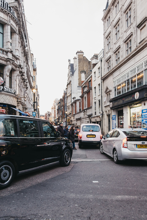London, UK - April 14, 2019: Traffic queuing on Rupert Street, a major street in the West End of London famous for excellent restaurants and LGBT+ venues.のeditorial素材