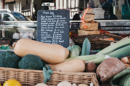 Lavenham, UK - April 19, 2019: Fresh local produce on sale in Lavenham Butchers in Lavenham, a village in Suffolk, England, famous for its Guildhall and half-timbered colourful medieval cottages.のeditorial素材