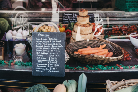 Lavenham, UK - April 19, 2019: Fresh local produce on sale in Lavenham Butchers in Lavenham, a village in Suffolk, England, famous for its Guildhall and half-timbered colourful medieval cottages.のeditorial素材