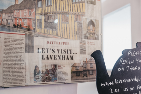 Lavenham, UK - April 16, 2019: Magazine article on a wall in Blue Vintage Tea Rooms, a famous cafe in Grade II listed 15th Century cottage in Lavenham, serving traditional afternoon teas and cakes.のeditorial素材
