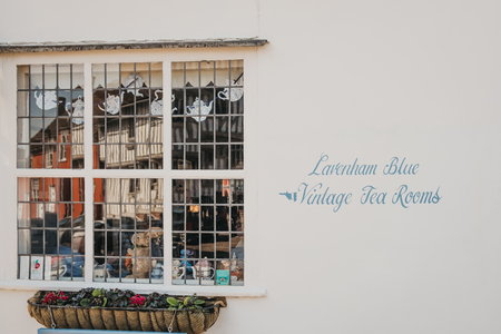 Lavenham, UK - April 16, 2019: Directional sign towards Blue Vintage Tea Rooms, a famous cafe in Grade II listed 15th Century cottage in Lavenham, serving traditional afternoon teas and cakes.のeditorial素材