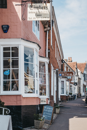 Lavenham, UK - April 19, 2019: Facades of the rows of shops in Lavenham, a village in Suffolk, England, famous for its Guildhall, Little Hall and its architecture.のeditorial素材