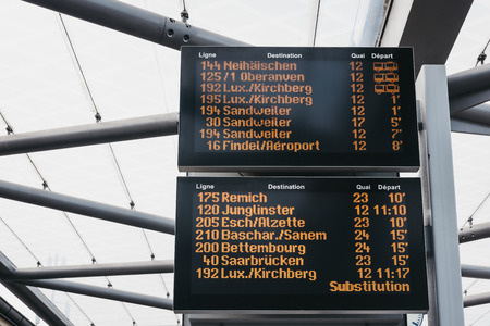 Luxembourg City, Luxembourg - May 18, 2019: Close up of bus departure board at a station in Luxembourg City. The city has a network of 31 bus routes, operated by the municipal transport authority,のeditorial素材