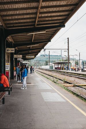 Ettelbruck, Luxembourg - May 18, 2019: People walking at a train station platform in Ettelbruck, Luxembourg, a major transportation hub for the country second only to the city of Luxembourg.のeditorial素材