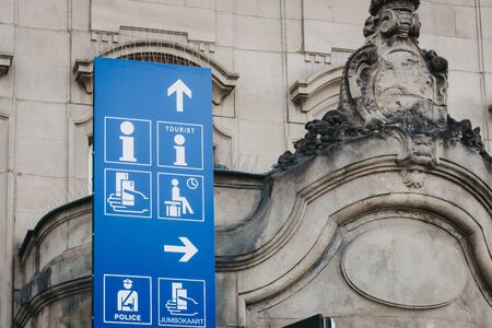 Luxembourg City, Luxembourg - May 18, 2019: Directional sign to facilities and information point outside of Gare de Luxembourg, the main railway station serving the city.のeditorial素材