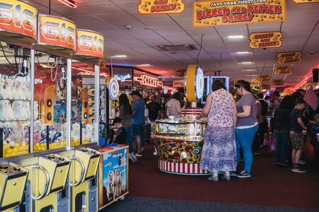 Cromer, UK - April 20, 2019: People playing at the arcade by the seaside in Cromer, a seaside town in Norfolk and a popular family holiday destination in UK.のeditorial素材