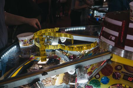 Cromer, UK - April 20, 2019: Close up of people playing at the arcade by the seaside in Cromer, a seaside town in Norfolk and a popular family holiday destination in UK.のeditorial素材