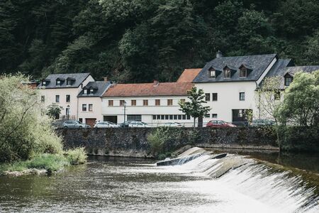 Vianden, Luxembourg - May 18, 2019: Weir on the river Our in Vianden, a town in Luxembourgs Ardennes region known for the centuries-old hilltop Vianden Castle.のeditorial素材